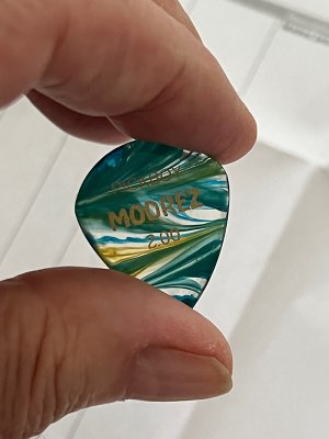 Modrez pick in hand 1.jpg