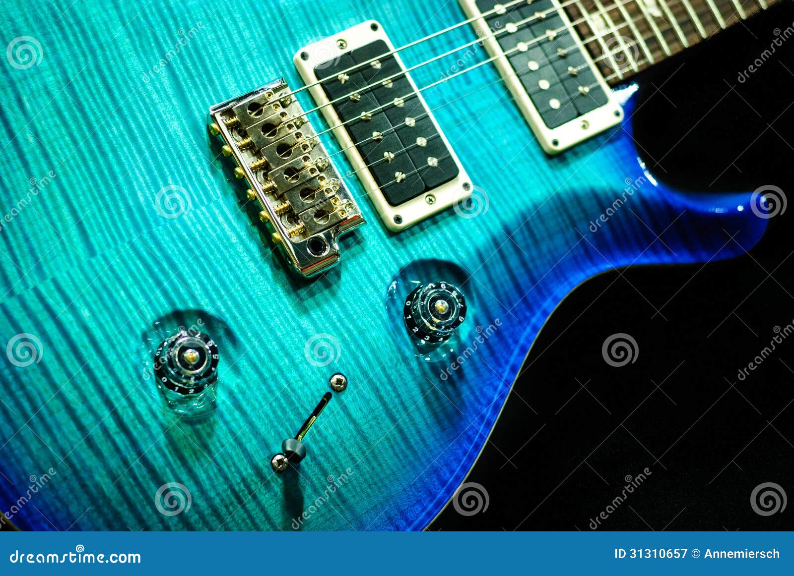 aquamarine-guitar-isolated-blue-rock-detail-31310657.jpg