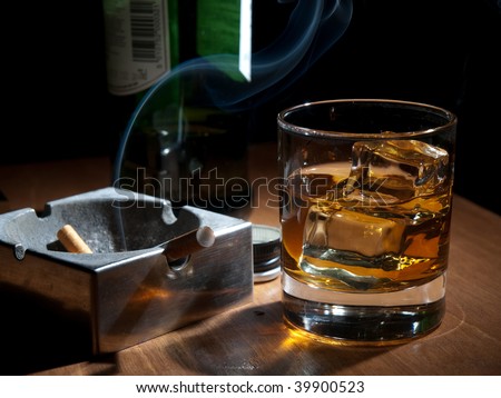 stock-photo-whiskey-and-cigarettes-unhealthy-lifestyle-lonely-drinking-at-night-39900523.jpg